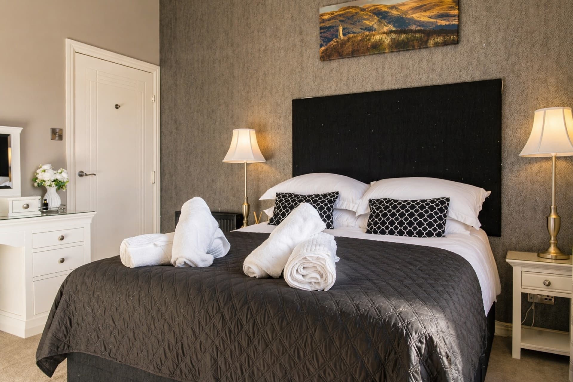 King bed with fresh towels