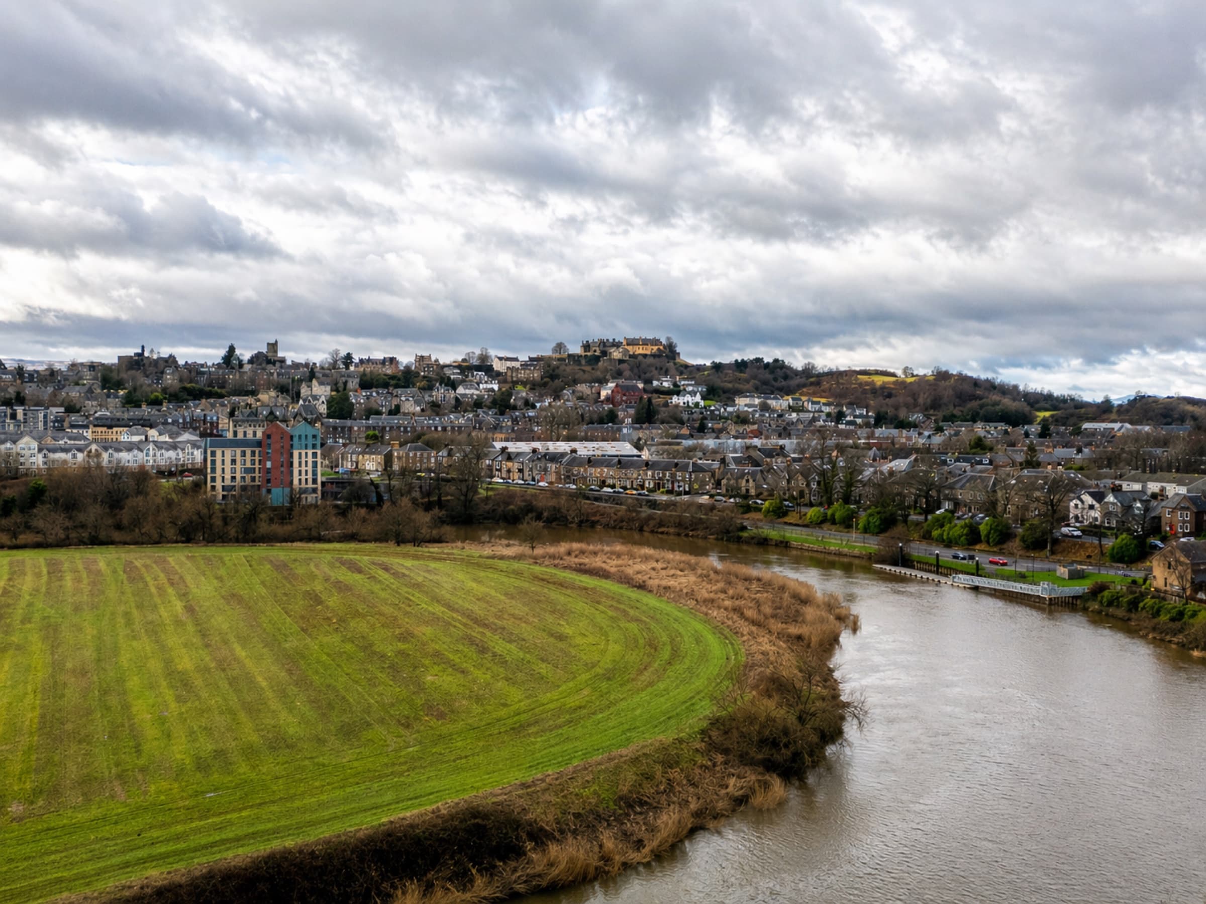 Aerial view of the apartment building beside the River Forth, with Stirling Castle in the distance