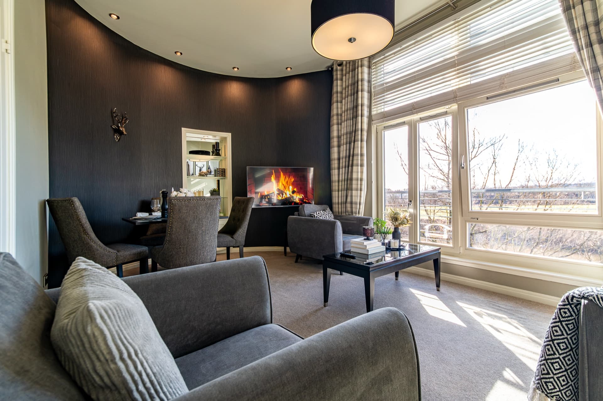 Corner of the living room showing seating and decor